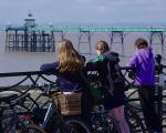 cyclists overlooking Clevedon PIer