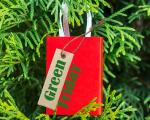 A Christmas tree ornament with the word green on it