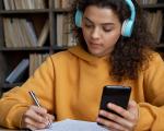 a young woman with headphones studying